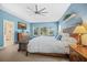 Light filled main bedroom showcases tray ceiling and a connecting bathroom at 1709 Blalock St, Mount Pleasant, SC 29466