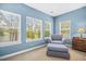 Cozy main bedroom seating area by multiple windows at 1709 Blalock St, Mount Pleasant, SC 29466