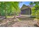 Serene backyard showcasing a screened-in porch, patio, and natural surroundings at 1851 Oleander Ct, Charleston, SC 29414