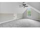 Light and airy bedroom featuring a ceiling fan, dormer window, and plush carpeting at 1851 Oleander Ct, Charleston, SC 29414