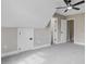 Spacious bedroom with neutral walls and carpet, featuring multiple doors for flexible use at 1851 Oleander Ct, Charleston, SC 29414