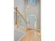 Bright and airy foyer with hardwood floors, staircase, and a transom window above the front door at 1851 Oleander Ct, Charleston, SC 29414