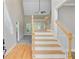 Elegant foyer with soaring ceiling, hardwood floors, staircase, and ample natural light at 1851 Oleander Ct, Charleston, SC 29414