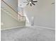 Bright living room featuring stairway, vaulted ceiling, and plush carpeting at 1851 Oleander Ct, Charleston, SC 29414