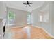 Bright, open living room with hardwood floors and a corner fireplace at 1851 Oleander Ct, Charleston, SC 29414
