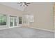 Bright living room with vaulted ceiling, plush carpet, and french doors that fill the space with light at 1851 Oleander Ct, Charleston, SC 29414