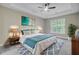 Relaxing main bedroom featuring a comfortable bed, ceiling fan, and stylish decor, all with natural light at 1851 Oleander Ct, Charleston, SC 29414