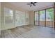 Covered porch with wood flooring, multiple windows, and view of the back yard at 1851 Oleander Ct, Charleston, SC 29414
