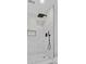 Modern shower with white marble-like tile, black fixtures including a rain showerhead, and a recessed shelf at 1851 Oleander Ct, Charleston, SC 29414