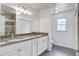 This full bathroom offers a tiled shower, double sink vanity and great natural light at 19 Milano Ct, Hanahan, SC 29410