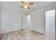 This bedroom offers great natural light, a ceiling fan and access to a closet and ensuite bathroom at 19 Milano Ct, Hanahan, SC 29410