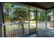 This screened porch offers beautiful views of the backyard and mature trees at 19 Milano Ct, Hanahan, SC 29410