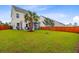 Expansive backyard with lush green grass, a privacy fence, and a charming screened-in porch at 192 Weeping Cypress Dr, Moncks Corner, SC 29461