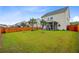 Lush backyard offers ample space for outdoor activities, complete with a privacy fence and charming screened-in porch at 192 Weeping Cypress Dr, Moncks Corner, SC 29461