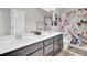 Bathroom featuring a double sink vanity with modern fixtures, a large mirror, and a shower-tub combo at 192 Weeping Cypress Dr, Moncks Corner, SC 29461