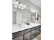 Bathroom featuring a double sink vanity with modern fixtures, a large mirror, and a shower-tub combo at 192 Weeping Cypress Dr, Moncks Corner, SC 29461