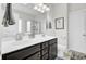 Bathroom featuring a double sink vanity with dark wood cabinets and a large mirror at 192 Weeping Cypress Dr, Moncks Corner, SC 29461
