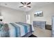 Bedroom with a queen-sized bed, ceiling fan, and light gray dresser at 192 Weeping Cypress Dr, Moncks Corner, SC 29461