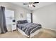 Cozy bedroom with neutral tones, two bright windows, and a modern ceiling fan at 192 Weeping Cypress Dr, Moncks Corner, SC 29461
