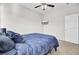 Bright bedroom featuring a ceiling fan, a closet with mirrored doors, and a large window at 192 Weeping Cypress Dr, Moncks Corner, SC 29461