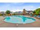 Large community pool surrounded by seating and complemented by a stone chimney pool house at 192 Weeping Cypress Dr, Moncks Corner, SC 29461