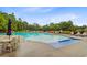 A stunning community pool with ample lounge chairs and a serene wooded backdrop at 192 Weeping Cypress Dr, Moncks Corner, SC 29461