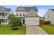 Charming two-story home with a well-manicured lawn and a two-car garage at 192 Weeping Cypress Dr, Moncks Corner, SC 29461