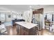 Open-concept kitchen featuring a large island, stainless steel appliances, and hardwood floors at 192 Weeping Cypress Dr, Moncks Corner, SC 29461