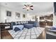 Spacious living room with hardwood floors, a ceiling fan, and an adjacent kitchen at 192 Weeping Cypress Dr, Moncks Corner, SC 29461
