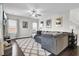 Cozy living room with a ceiling fan, recessed lighting, large sectional sofa, and decorative accents for a relaxing ambiance at 192 Weeping Cypress Dr, Moncks Corner, SC 29461
