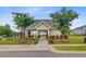 Community pool house with stone accents and shaded seating areas at 192 Weeping Cypress Dr, Moncks Corner, SC 29461