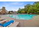 Large community pool surrounded by lounge chairs and lush greenery at 192 Weeping Cypress Dr, Moncks Corner, SC 29461