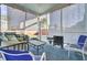 Relax on this screened porch with a view of the backyard at 192 Weeping Cypress Dr, Moncks Corner, SC 29461