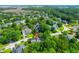 An aerial view of the neighborhood with many mature trees, ponds, and well-maintained lawns at 200 Oak Point Landing Dr, Mount Pleasant, SC 29464