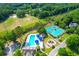 Aerial view showcases community amenities, including a pool, tennis courts, and playground area at 200 Oak Point Landing Dr, Mount Pleasant, SC 29464