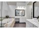 Bright bathroom featuring a soaking tub, vanity, and lots of natural light at 200 Oak Point Landing Dr, Mount Pleasant, SC 29464