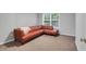 Inviting carpeted bedroom offering a cozy brown leather couch with a window view at 200 Oak Point Landing Dr, Mount Pleasant, SC 29464