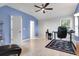 Bedroom features vaulted ceilings, ceiling fan, wood-look floors, a desk and blue accent wall at 200 Oak Point Landing Dr, Mount Pleasant, SC 29464