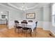 Elegant dining room with hardwood floors, chandelier, and ample natural light at 200 Oak Point Landing Dr, Mount Pleasant, SC 29464