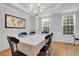 Bright dining room with hardwood floors, large windows, and a classic chandelier at 200 Oak Point Landing Dr, Mount Pleasant, SC 29464