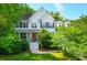 Charming two-story home featuring a welcoming front porch and well-maintained landscaping at 200 Oak Point Landing Dr, Mount Pleasant, SC 29464