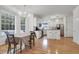 Bright eat-in kitchen features white cabinetry, stainless appliances, and hardwood flooring at 200 Oak Point Landing Dr, Mount Pleasant, SC 29464