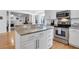 Well-appointed kitchen features stainless appliances and a granite-topped island with bar seating at 200 Oak Point Landing Dr, Mount Pleasant, SC 29464