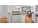 Kitchen island features granite countertop, storage, and is open to the living room at 200 Oak Point Landing Dr, Mount Pleasant, SC 29464