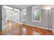 Bright living room with hardwood floors, French doors, and large windows at 200 Oak Point Landing Dr, Mount Pleasant, SC 29464