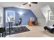 Stylish office space featuring a blue accent wall, modern desk setup, and natural lighting at 200 Oak Point Landing Dr, Mount Pleasant, SC 29464