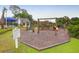 Community playground includes a swing set, climbing structures, and playground rules at 200 Oak Point Landing Dr, Mount Pleasant, SC 29464