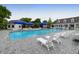 Resort-style community pool featuring lounge chairs, umbrellas and a pool house at 200 Oak Point Landing Dr, Mount Pleasant, SC 29464