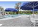 Community pool featuring a zero entry area, umbrellas, lounge chairs and table seating at 200 Oak Point Landing Dr, Mount Pleasant, SC 29464