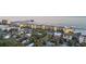 Aerial view of oceanfront condos with pools, beach, and pier, a delightful coastal destination at 201 W Arctic Ave # 406, Folly Beach, SC 29439